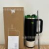Gourde Stanley Quencher H2.0 Tumbler 40 oz / 1.18 L avec anse — noir (corps), base crème, couvercle vert, poignée noire