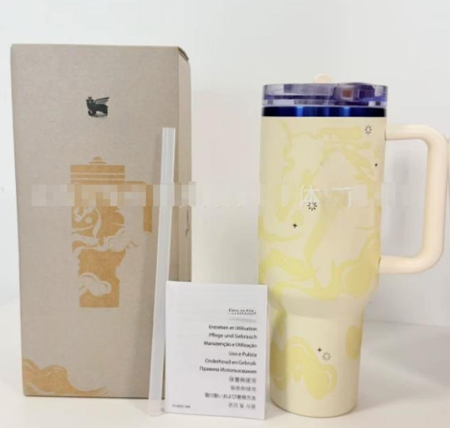 Gourde Stanley Quencher ProTour Tumbler 40 oz | 1.18 L avec anse — jaune pâle / crème, motif marbré/nuageux ton sur ton
