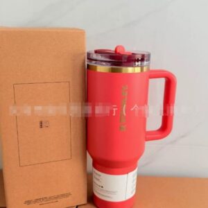 Gourde Stanley Quencher Tumbler avec anse — corail / rouge-orangé
